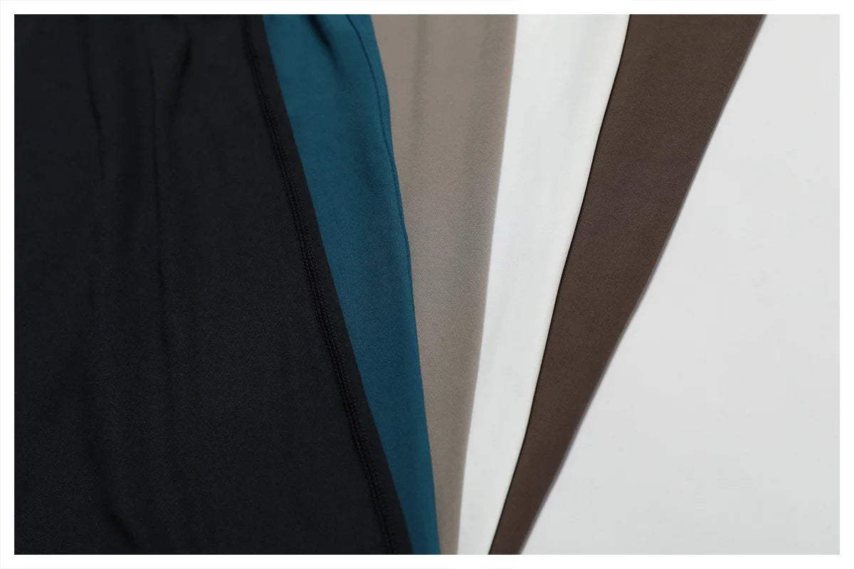 THE NOIR – OPEN BACK FLARE JUMPSUIT